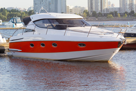White and red modern yacht at the pier. Transportの写真素材