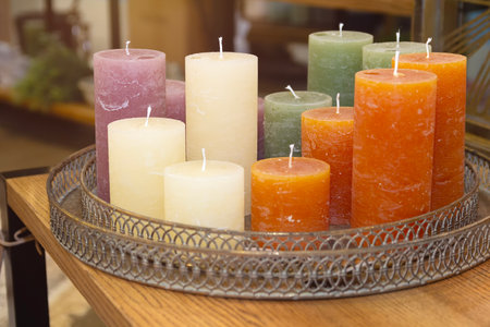 Multicolored decorative candles on the table. Interiorの写真素材