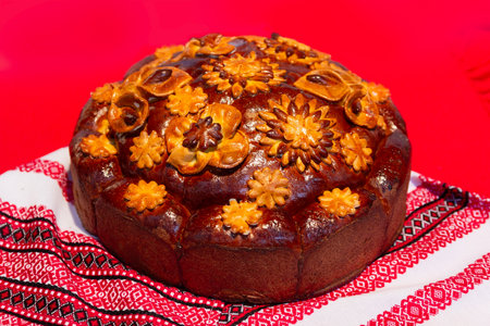 Decorated fresh loaf with salt. Ukrainian wedding traditions.