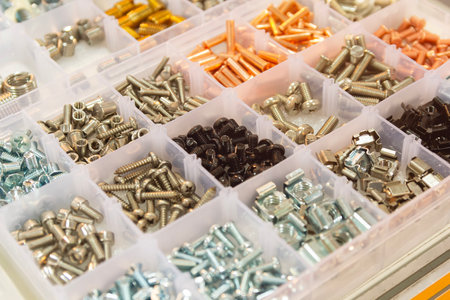 Bolts, screws, nuts, rivets on a counter of shop. Retailの写真素材