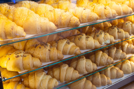 Delicious fresh croissants in the shop window. Foodの写真素材