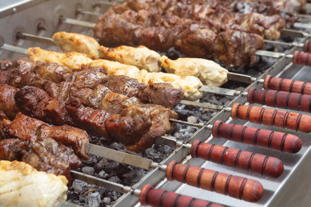 Shish kebab on skewers is prepared on the grill. Foodの写真素材