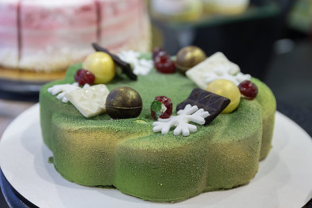Delicious green cake on a shop window close-up. Foodの写真素材