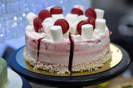 Delicious pink cake on a shop window close-up. Foodの写真素材