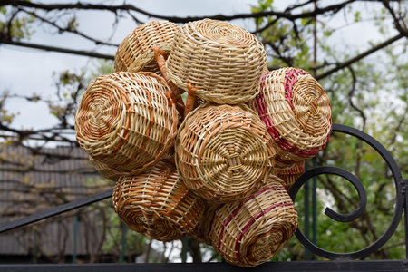 Vintage wicker baskets hanging on the market. Craftの写真素材