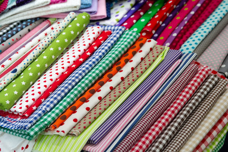 Multicolored textiles on the counter of the store. Saleの写真素材