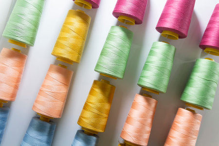 Colorful embroidery thread rolls for sewing machine. Industryの写真素材