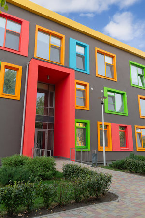 The facade of the multi-colored building of the modern schoolの写真素材