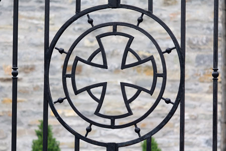 Steel fencing of the church with a cross decoration. Architectureの写真素材