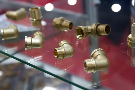 Brass water fittings on a store window. Industryの写真素材