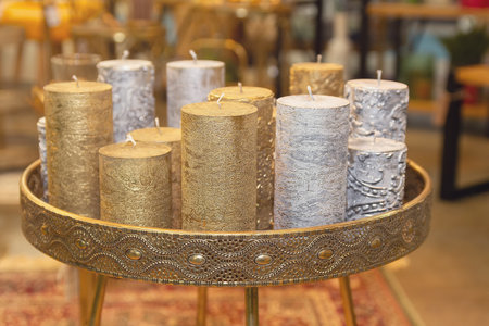 Multicolored decorative candles on the table. Interiorの写真素材