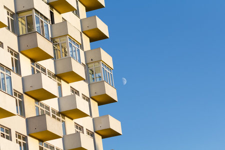 A new multi-storey building under construction against a blue sky. Construction industrialの写真素材