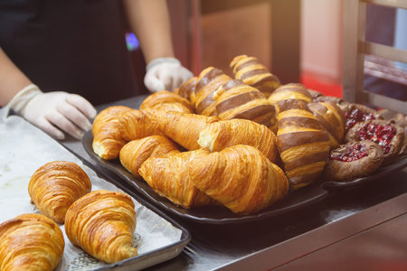 Fresh croissants on counter at bakery. Foodの写真素材