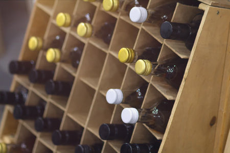 Wine bottles on the shelf of the wine cellar. Drinkの写真素材