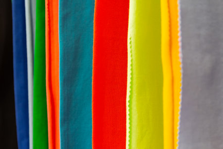 Colorful fabrics hang in a row. Textile industryの写真素材