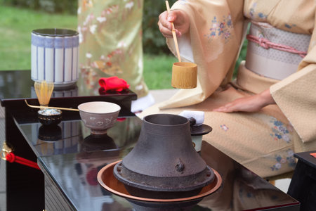 Woman in kimono performs Japanese tea ceremony. Japanese culture and traditionsの写真素材