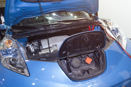 Electric car with an open hood on diagnostics in the car service. Transportの写真素材