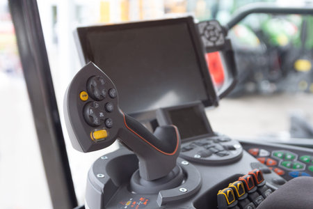 The cabin and control stick tractor of a modern tractor close-up. Industryの写真素材