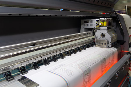 Large format printing machine in operation. Industry