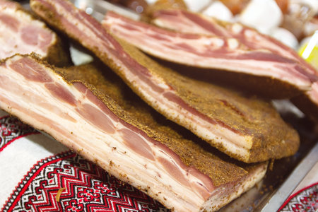 Fresh delicious bacon on a traditional Ukrainian towel. Foodの写真素材