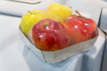 Fresh apples packaged on the store counter. Fruitの写真素材