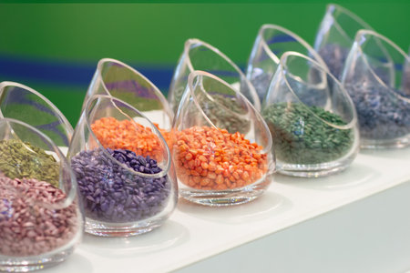 Multicolored seeds on the exhibition stand. Agriculture