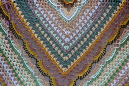 Intricate crochet shawl, pastel rainbow colors. Retro