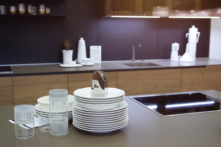 Dishes on the table of a modern kitchen. Interior