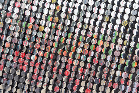 Silver sequin wall with sparkling reflections. festive. Colorful backdropの写真素材