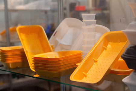 Plastic food trays in a showcase. Industryの写真素材