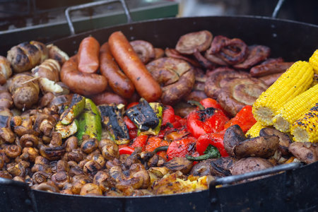 Delicious fried sausages and vegetables. Food