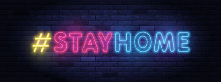 I Stay home hashtag in neon style. Coronavirus pandemic protection and prevention effort. Social activity message. Self-isolation and quarantine. To stay at home brightly illuminated neon sign on wall