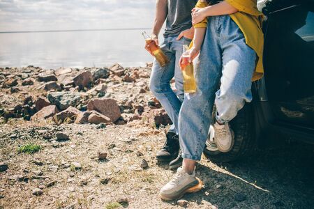 Travel, tourism - Picnic near the water. Couple going on Adventure. Car travel concept. Man and...