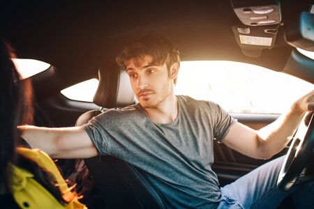 tourism - Happy young Man and woman Happy sit in a car. Travel and adventure concept.