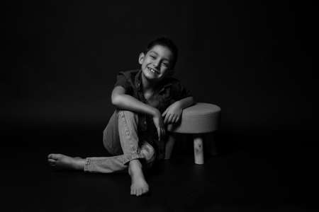 boy posing on a black background. model. close upの写真素材