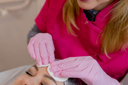 apparatus massager ultrasonic rf lifting in the hand of a beautician in a glove . Cosmetic apparatus for lifting and mesotherapy.の写真素材
