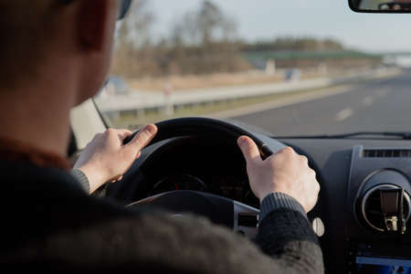 guy driving a car .Young man driving a car, interior shot . drivingの写真素材