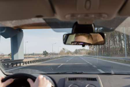 guy driving a car .Young man driving a car, interior shot . drivingの写真素材
