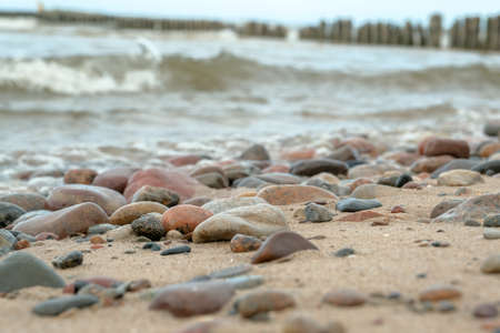 Sea waves lash line impact rock on the beach. beautiful sea view with stonesの写真素材