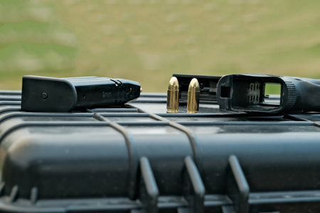 the pistol lies on the table 9 mm. the gun is on the cartridges. military weaponsの写真素材