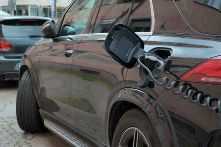 green energy concept. electric car stands at the charging station.