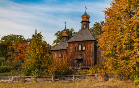 Wooden church in the autumn forest.の写真素材