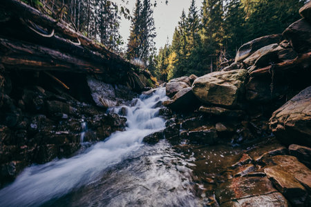 A large waterfall over a rocky areaの写真素材
