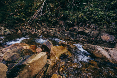 A large waterfall over a rocky areaの写真素材