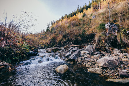 A large waterfall over a rocky areaの写真素材