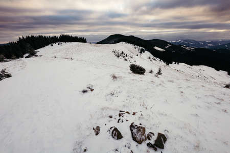 A snow covered mountain in snow a mountainの写真素材