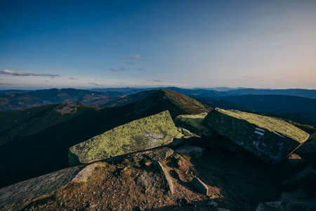 A sign on a rocky hillの写真素材