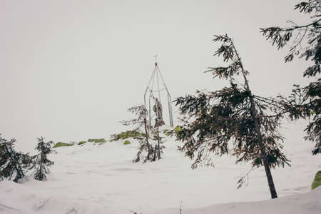 A man riding skis down a snow covered slopeの写真素材
