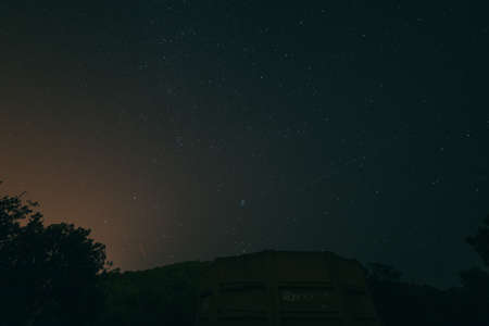 A white sign with red and blue sky in the backgroundの写真素材