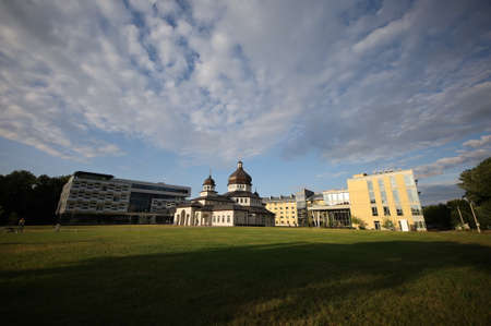 A large building with a grassy fieldの写真素材